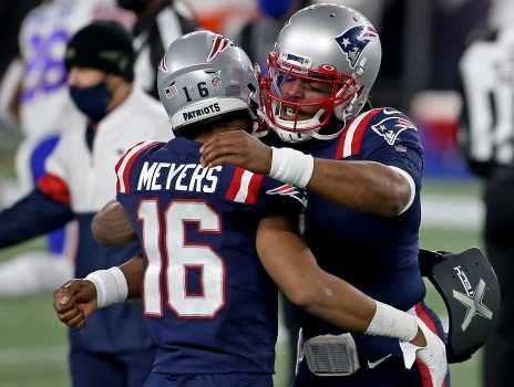 Patriots Cam Newton (1) and Jakobi Meyers (16)